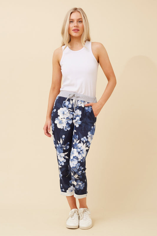 Full view of Navy Janja Floral Jogger Pants with rolled up hem and waistband for a unique look 